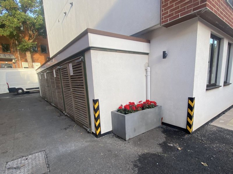 Bin store surround, corner cladding and hard-standing cleaned