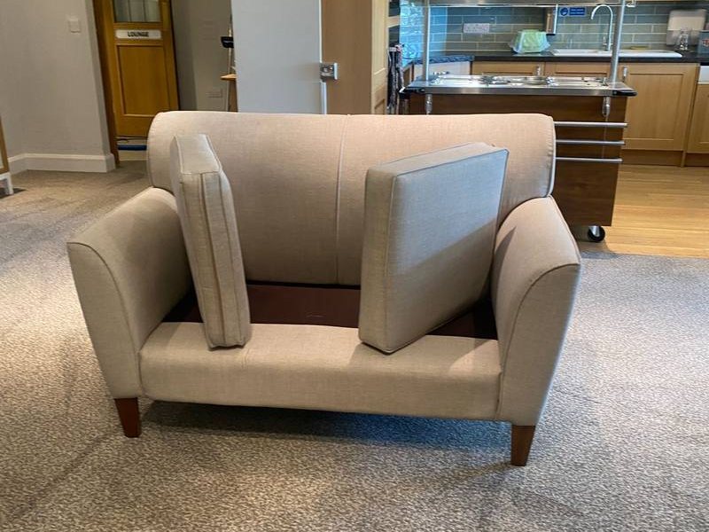 Upholstery cleaning, armchair cushions cleaned in situ in a resident lounge