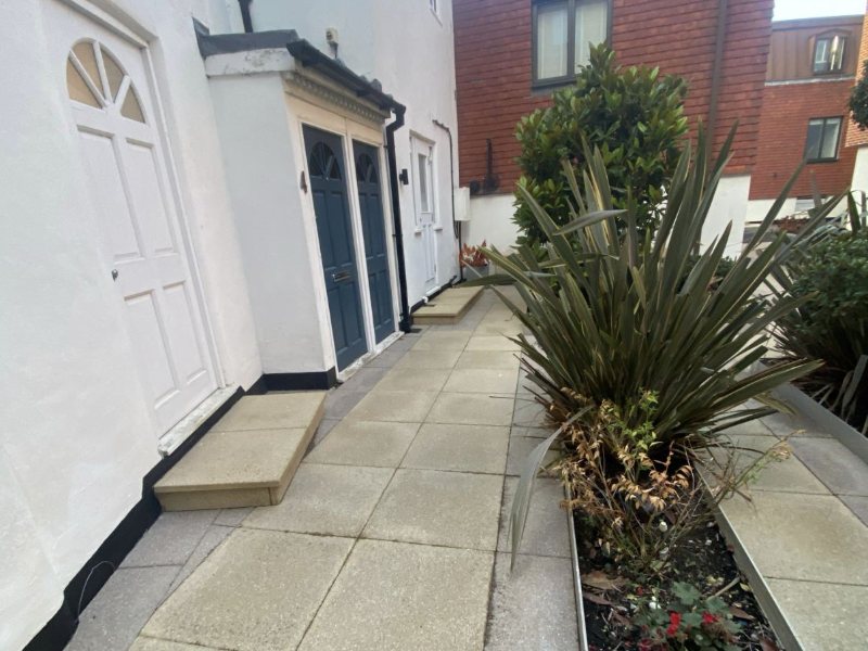 Ground-floor entrance paths, cleared of moss and organic staining