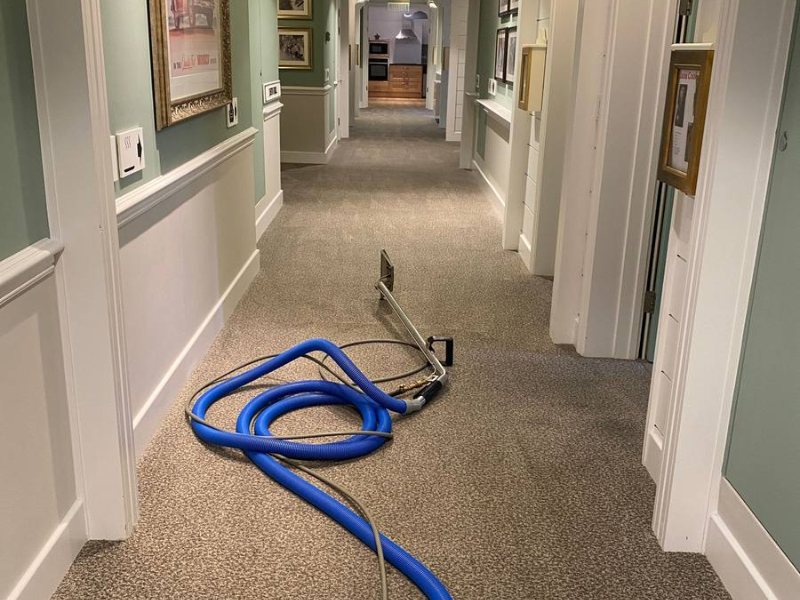 Hilltops communal landing, portable hose run the full length of the corridor