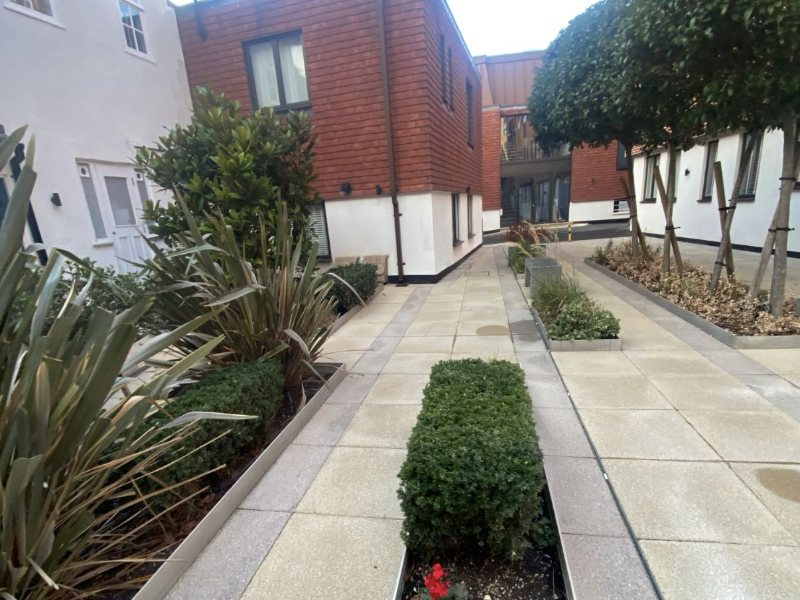 Landscaped courtyard walkway, paving cleaned and pressure washed