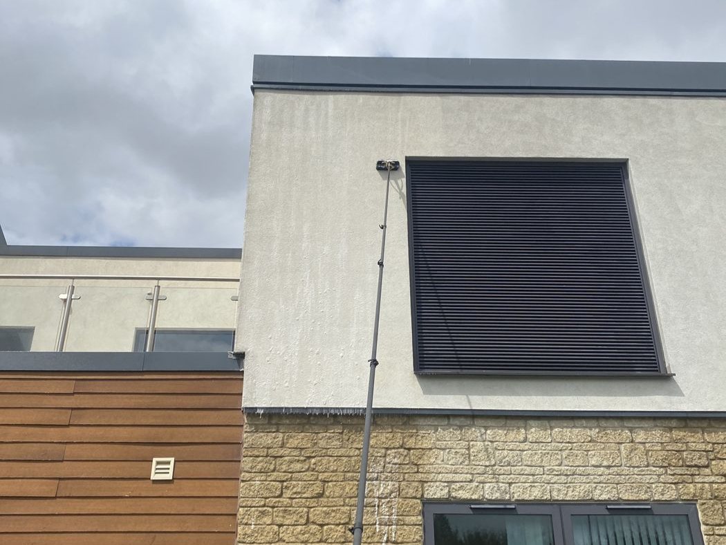 Low-pressure application by pole on the car park elevation, no scaffold required
