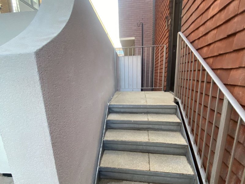 Rear stairwell, alternate view of the completed clean
